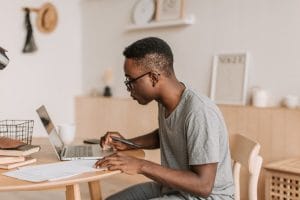 a person sitting at a desk looking at their chart of accounts